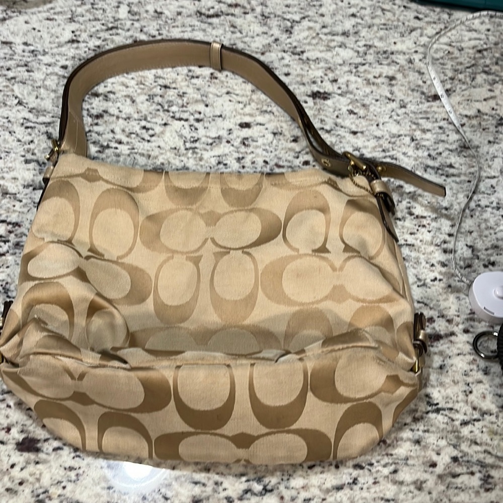 Gold and pink coach purse
